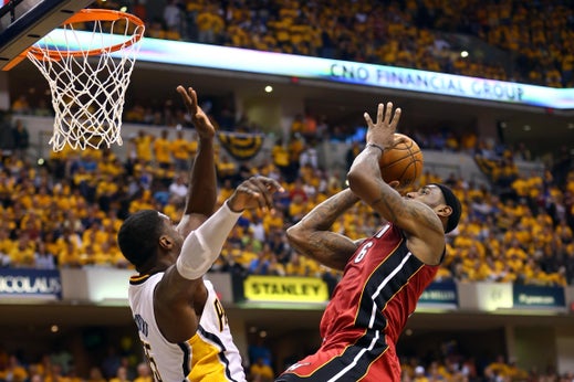 LeBron James, No. 6 of the Miami Heat, dunks the ball against Roy Hibbert, No. 55 of the Indiana Pacers, in Game 6 of the Eastern Conference Finals during the 2013 NBA Playoffs at Bankers Life Fieldhouse on June 1, 2013, in Indianapolis.